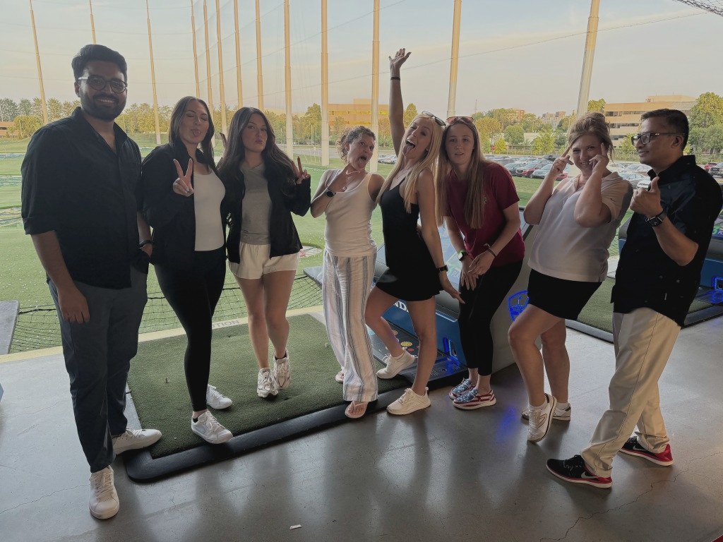 The team at a Top Golf outing.