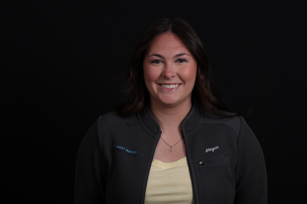 Patient portrait — natural smile after veneer treatment.